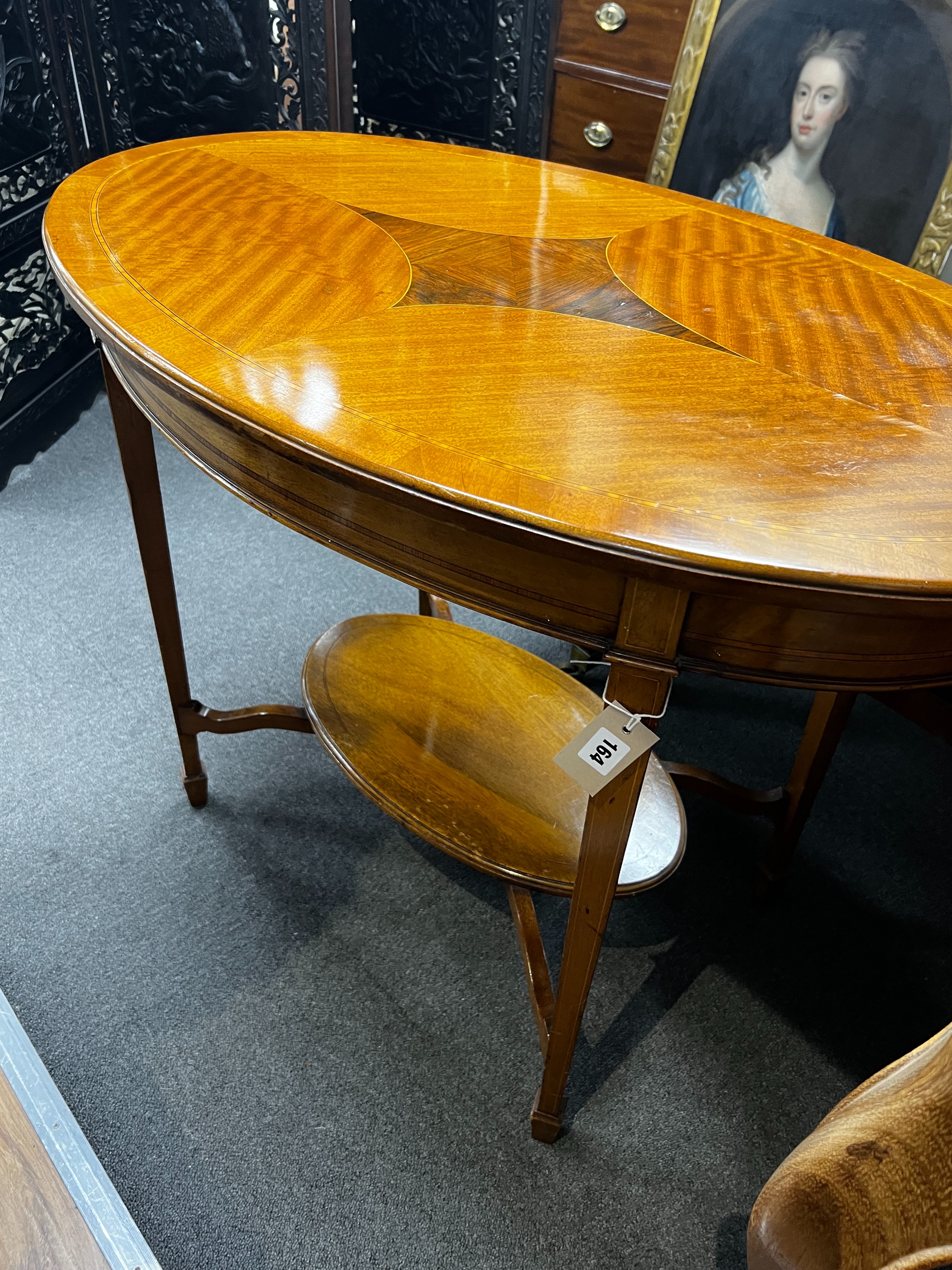 An Edwardian satinwood banded oval satinwood two tier centre table, width 98cm, depth 60cm, height 73cm